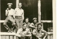 Grandpa seated on bottom step on the right